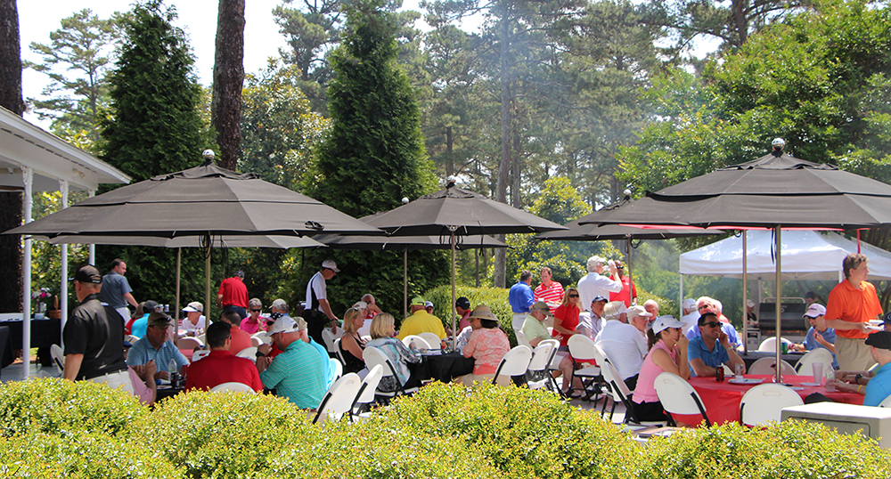 Photo of a group eating outside at the course.